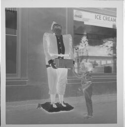 Untitled (Boy With Statue Outside Ice Cream Shop)