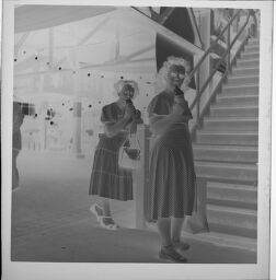 Untitled (Two Women Around Grandstands And Stairs)