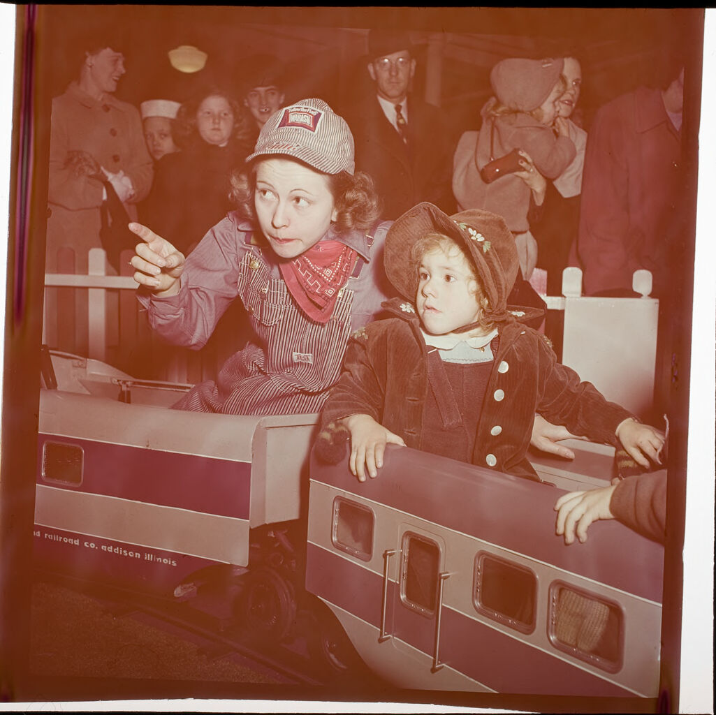 Untitled (Children Riding On Toy Train)