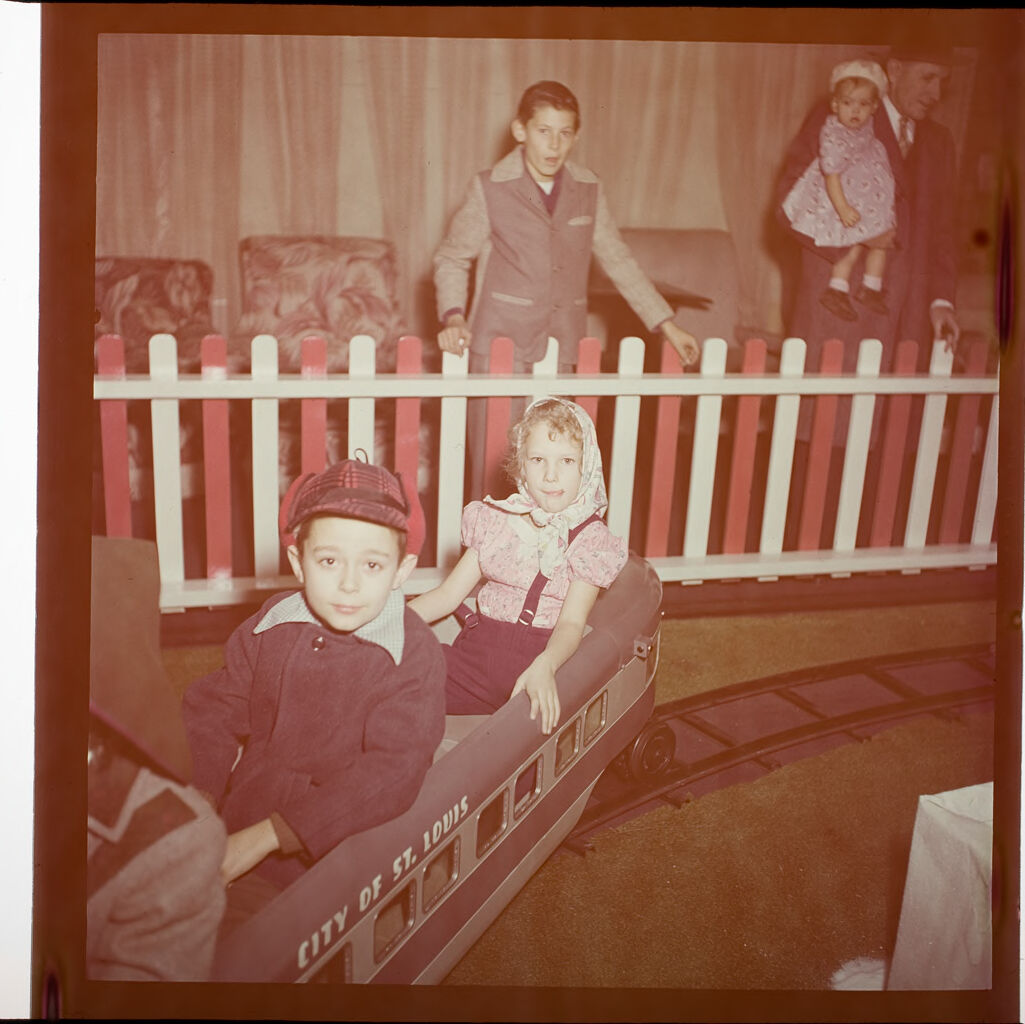 Untitled (Children Riding On Toy Train)