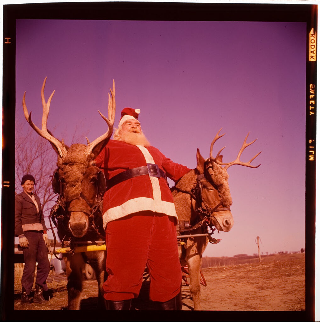 Untitled (Man Dressed As Santa Claus With Children And Reindeer)