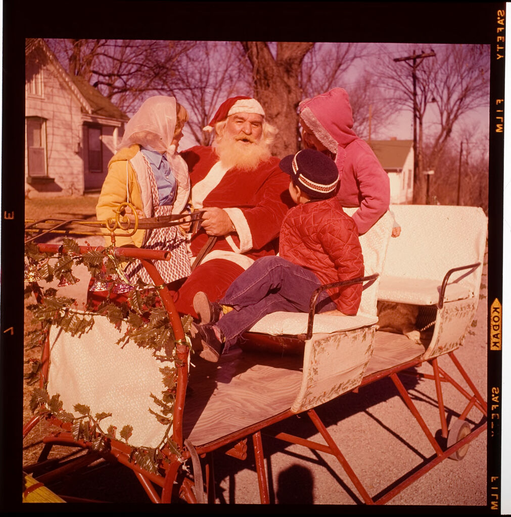 Untitled (Man Dressed As Santa Claus With Children On Sleigh)