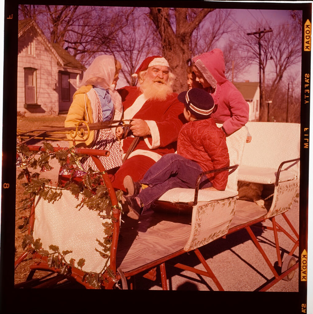 Untitled (Man Dressed As Santa Claus With Children On Sleigh)