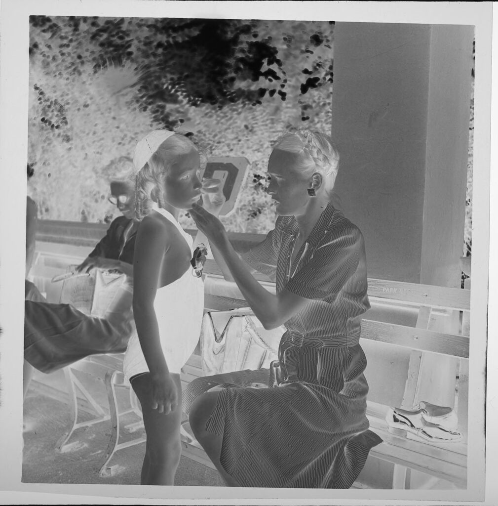 Untitled (Mother Putting Make-Up On Daughter In Swimsuit)