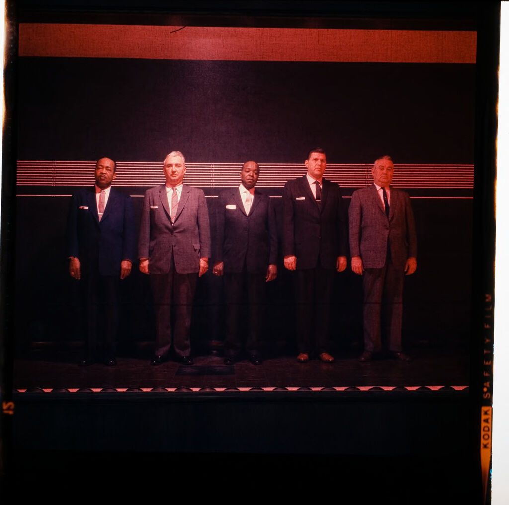 Untitled (Men In Suits Standing In Police Line-Up)