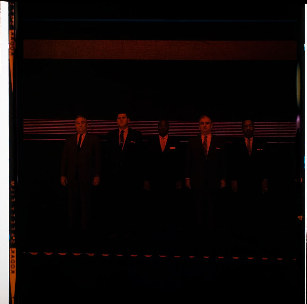 Untitled (Men In Suits Standing In Police Line-Up)