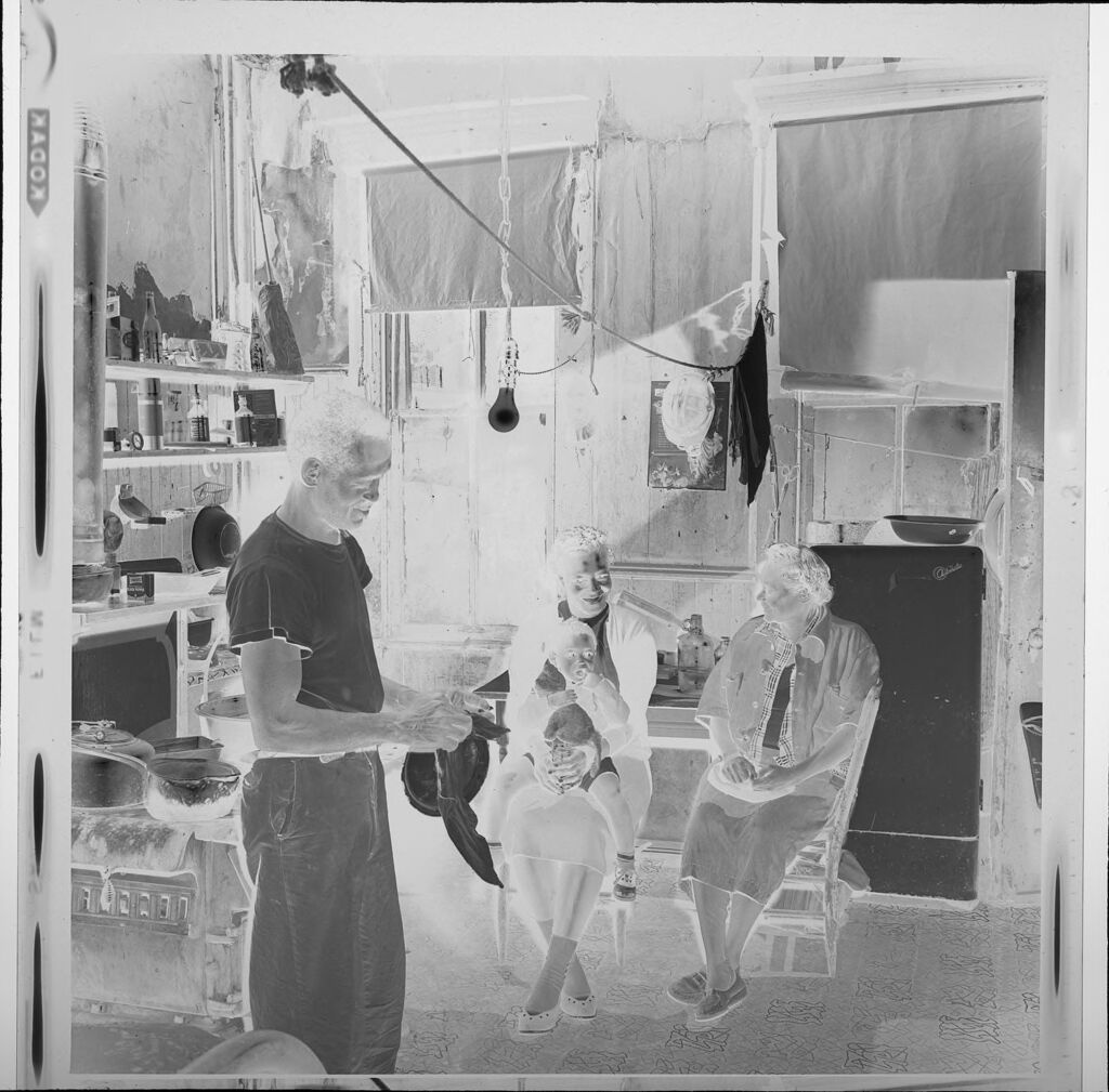 Untitled (Family Inside Run-Down House)
