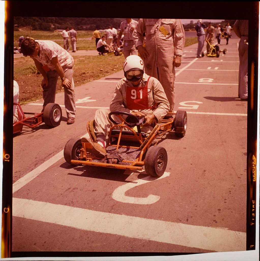 Untitled (Drivers Drag-Racing In Tiny Cars)
