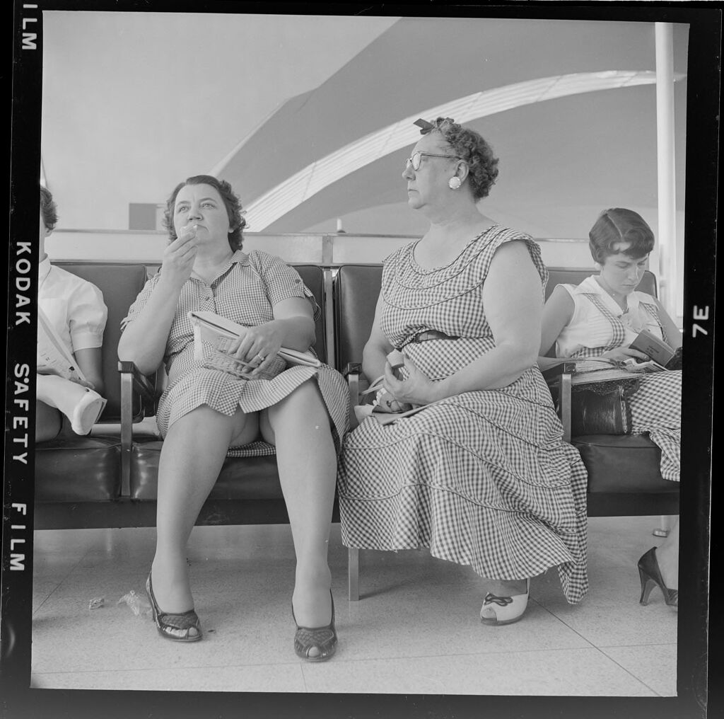 Untitled (People Sitting In Airport Waiting Area)