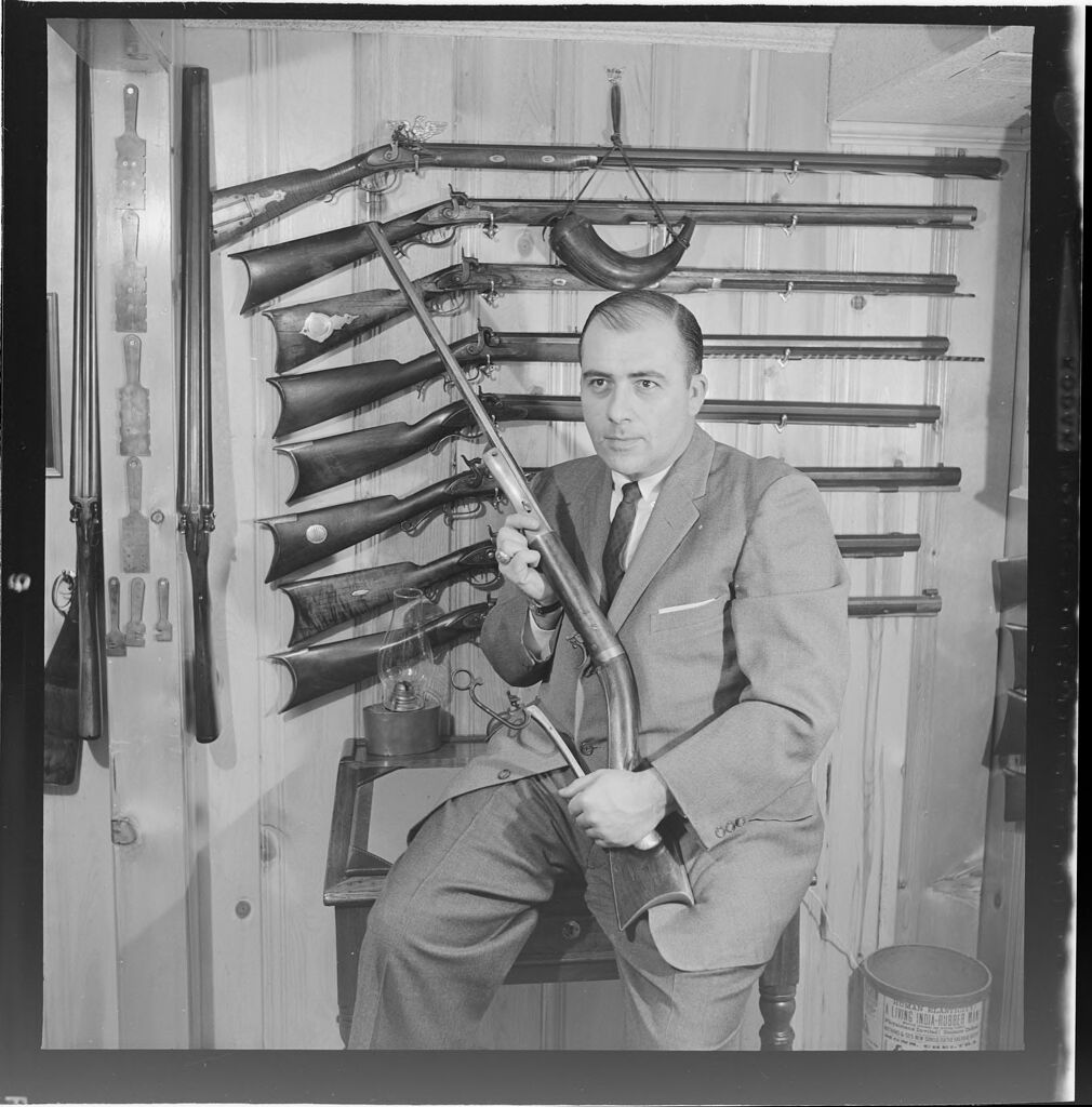 Untitled (Man With Large Gun Collection)
