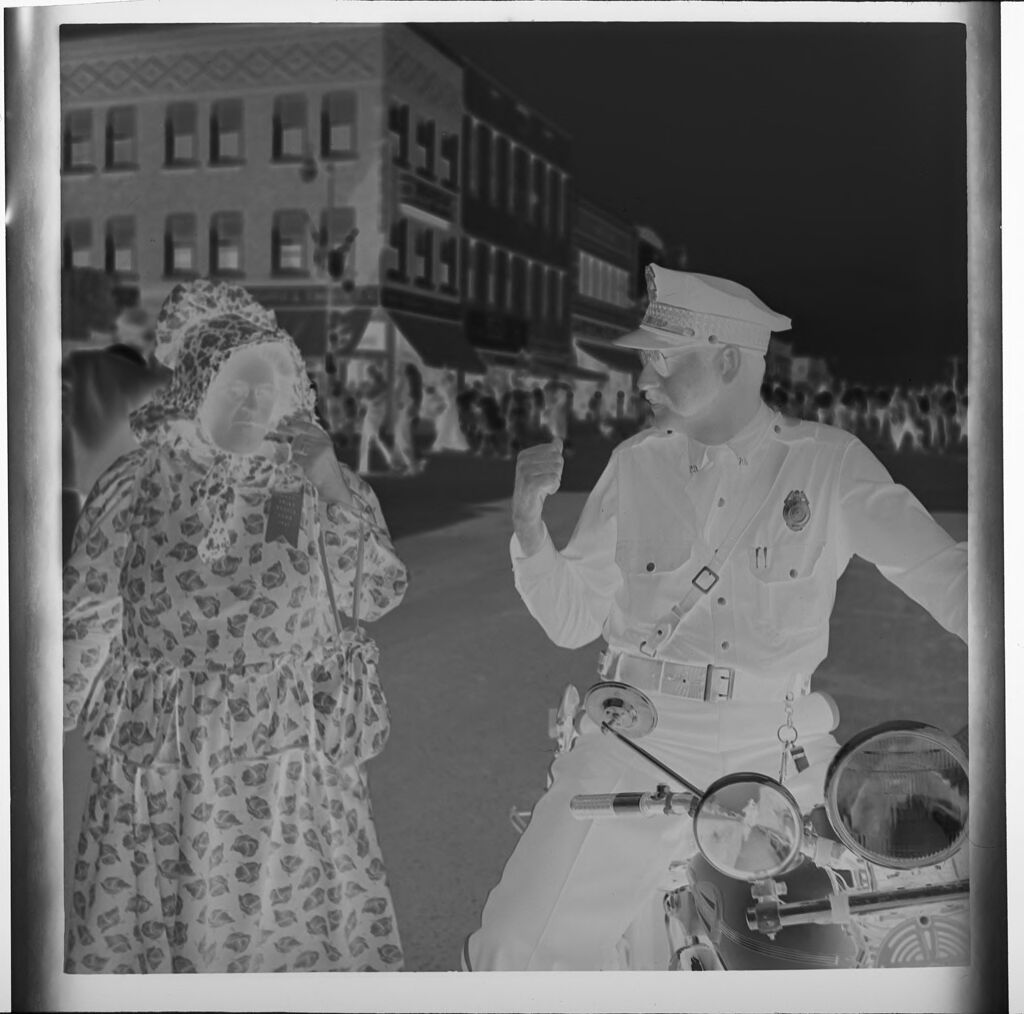 Untitled (Woman In Old-Fashioned Clothes Next To Policeman)
