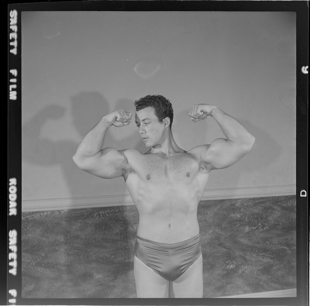 Untitled (Man Flexing Muscles In 