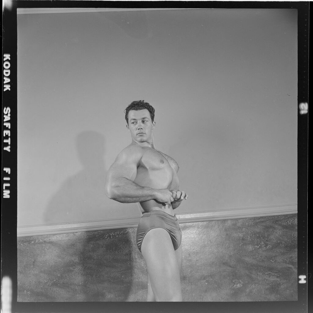 Untitled (Man Flexing Muscles In 