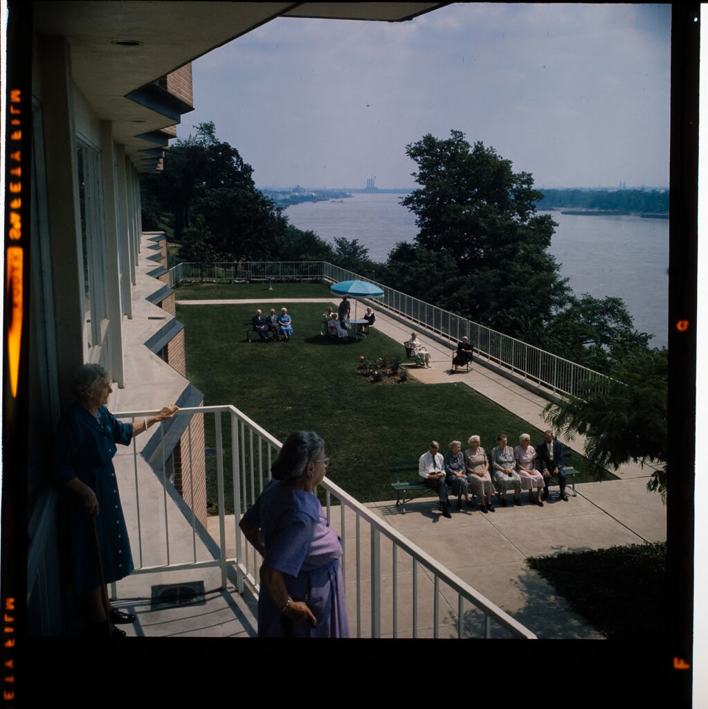 Untitled (Woman Looking At View Of River From Balcony Of Retirement Home)