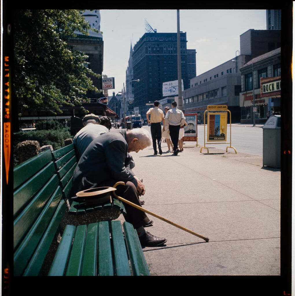 Untitled (Elderly Man Sitting On City Bench, Head Down)
