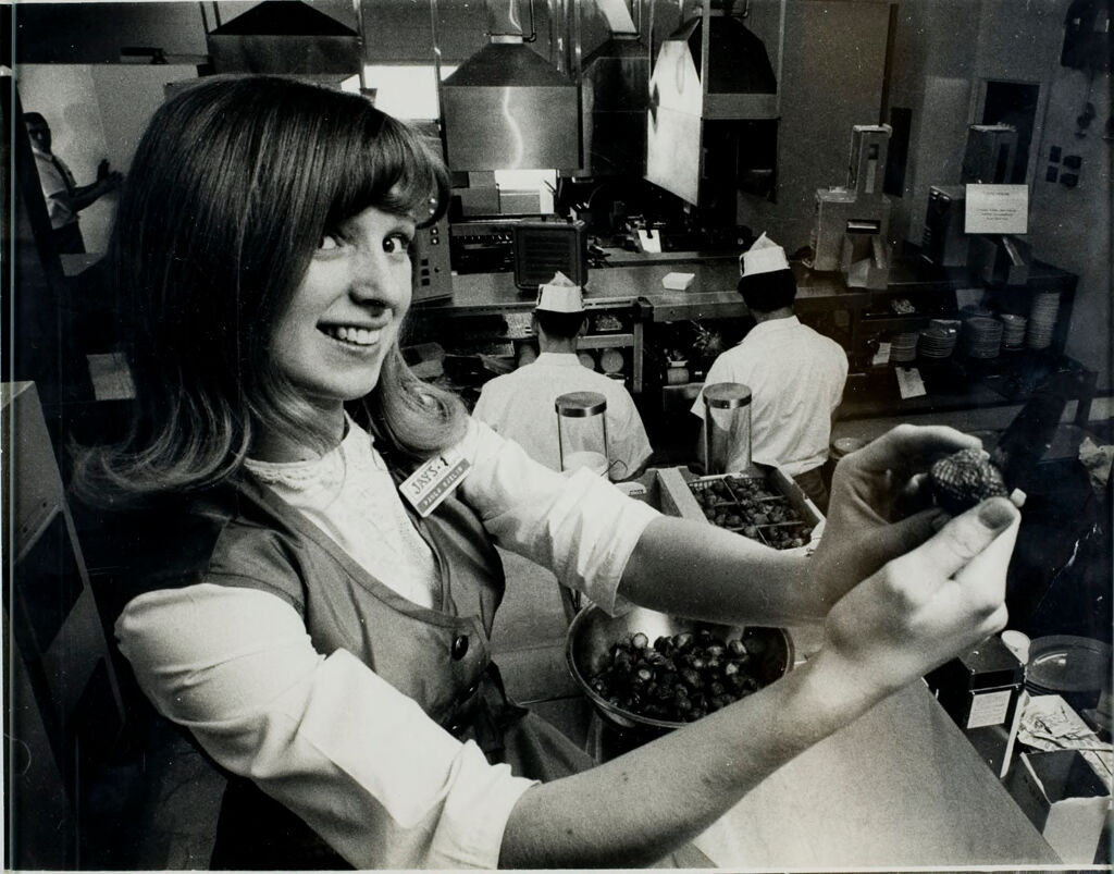 World's First Fully Automated Restaurant (Fourth Of Eight): Strawberries Are Different.... Paula Svelin Has To Do Her Work By Hand As She Pares Strawberries.  Behind Her, Nearly Every Other Food Preparation Task Is Taken Care Of By Machine.  The Strawberries Are Used For Strawberry Pie.