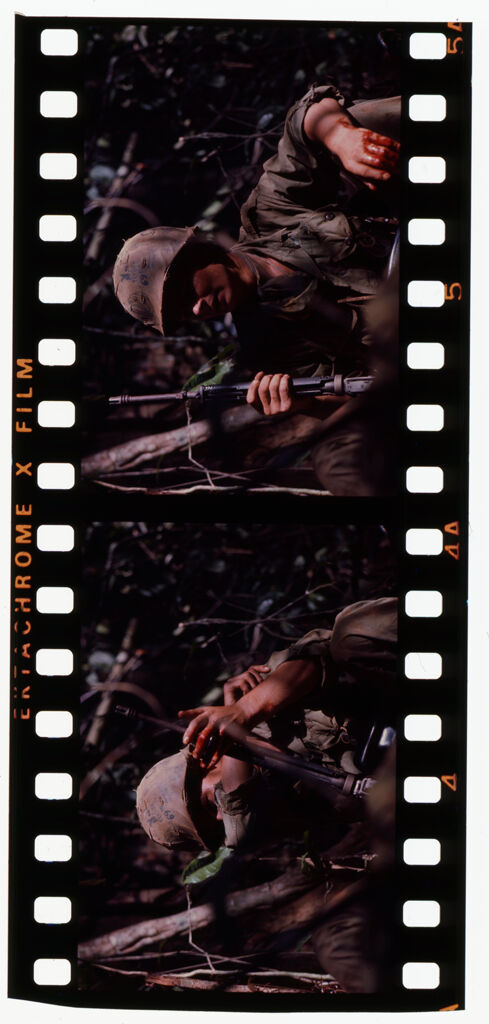 Untitled (Camouflaged Soldier Holding Gun During Fighting In Central Highlands Near Dak To, Vietnam)