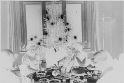 [Feininger Family Gathered Around Table And Christmas Tree]