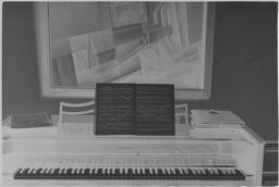 [Piano With Framed Lyonel Feininger Painting]