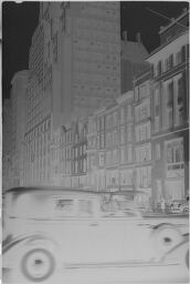 [Car Going Down New York City Street]