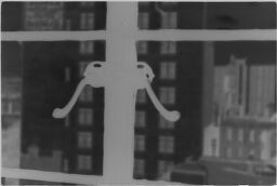 [Window Latch And View Of Building In Distance]