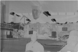 [Reflection Of Lyonel And Laurence Feininger In Shop Window, Plymouth, Massachusetts]