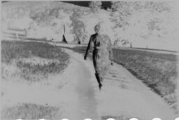 [Back View Of Julia Feininger Walking On A Path]