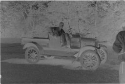 [Man In Antique Car]