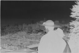 [View From Above Of City With Man And Woman In Foreground]