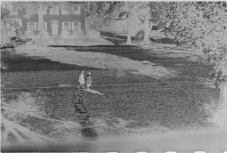 [View From Above Of Two Women Walking]