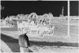 [Group On Decorated Horse Drawn Cart In Parade]