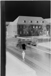 [View From Above Of Person Walking On Street In Evening Light, Siemensstadt]