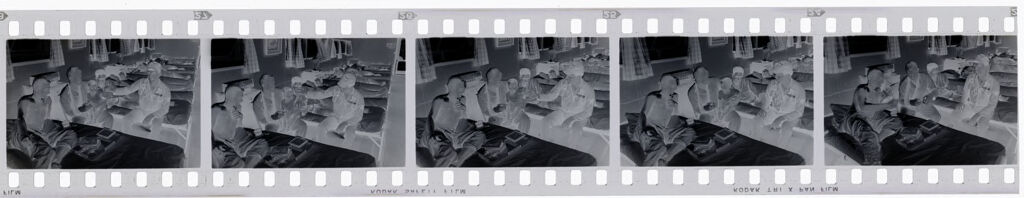 Untitled (Recovering Soldiers In Hospital Ward; Playing With Vietnamese Child, Vietnam)