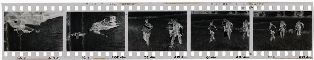 Untitled (Soldiers Carrying Supplies Through A Field, Vietnam)