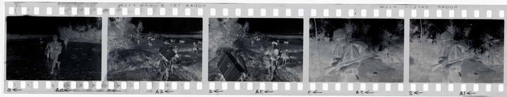 Untitled (Soldiers Carrying Supplies Across Field, Vietnam)