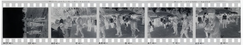 Untitled (Soldiers Milling Around In Front Of Thatched Huts; Soldiers In Rice Paddy, Vietnam)