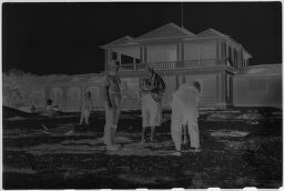 [Unknown People In Front Of Beach House]