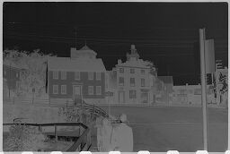 [Distant View Of Village Houses With People In Foreground, New England]