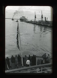 [Flag And Passengers On Ship Deck]