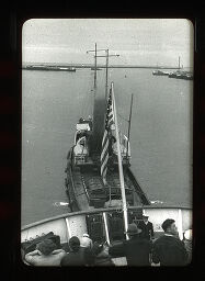 [Flag, Tugboat, Figures On Ship Deck]
