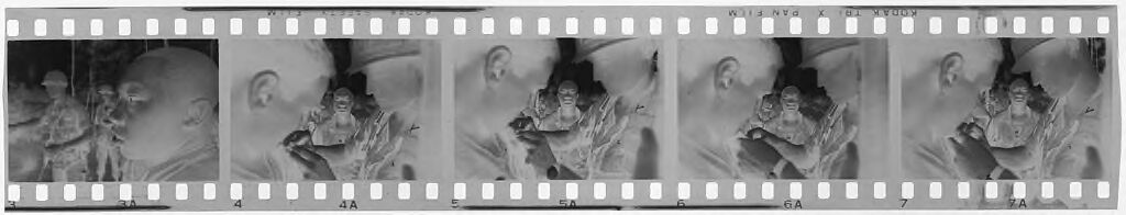Untitled (Soldiers Pinning Insignia On Uniforms, Vietnam)