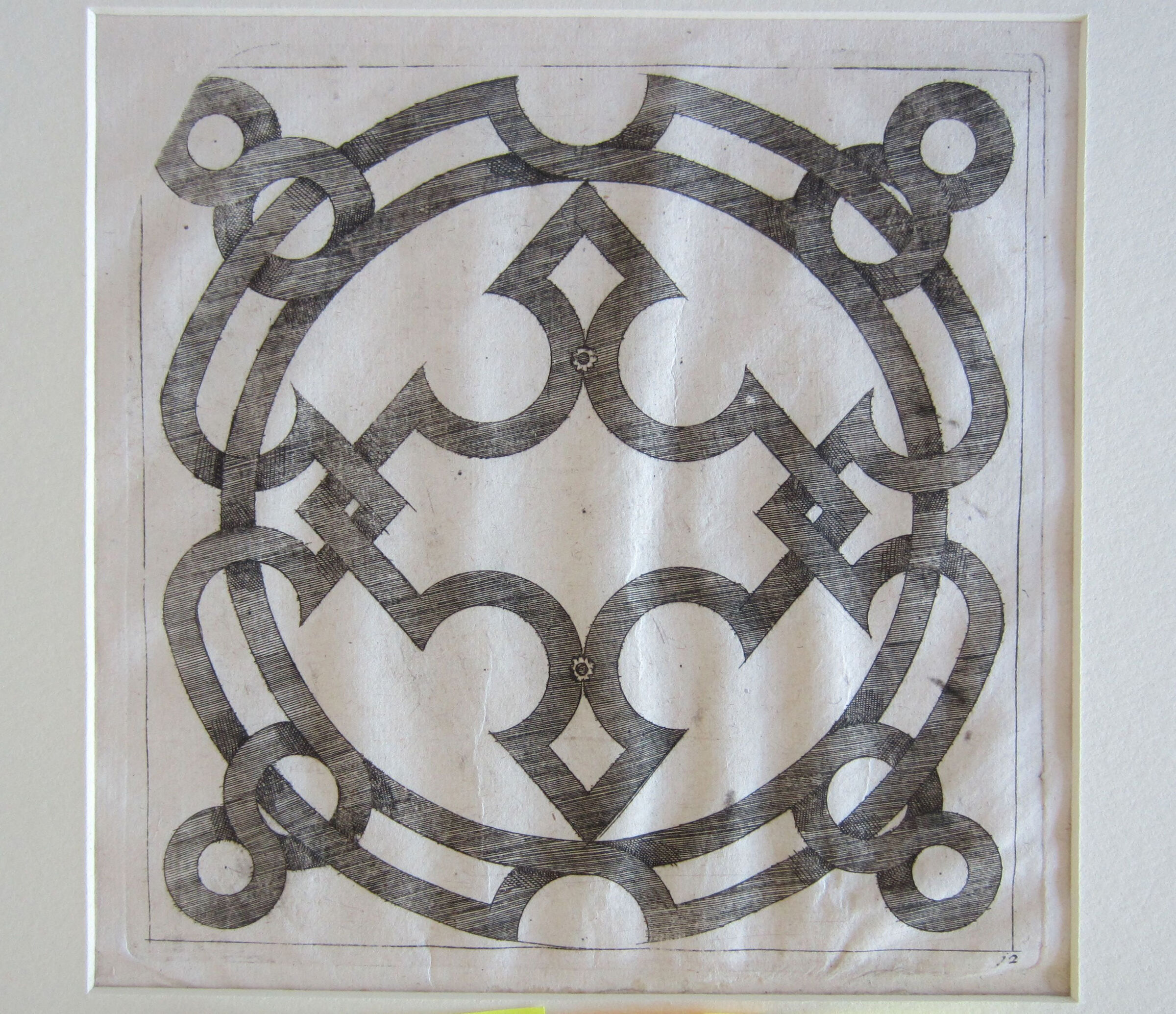 Interlace Centered By A Cross-Shaped Element, Its Upper And Lower Arms Centered By Small Rosettes
