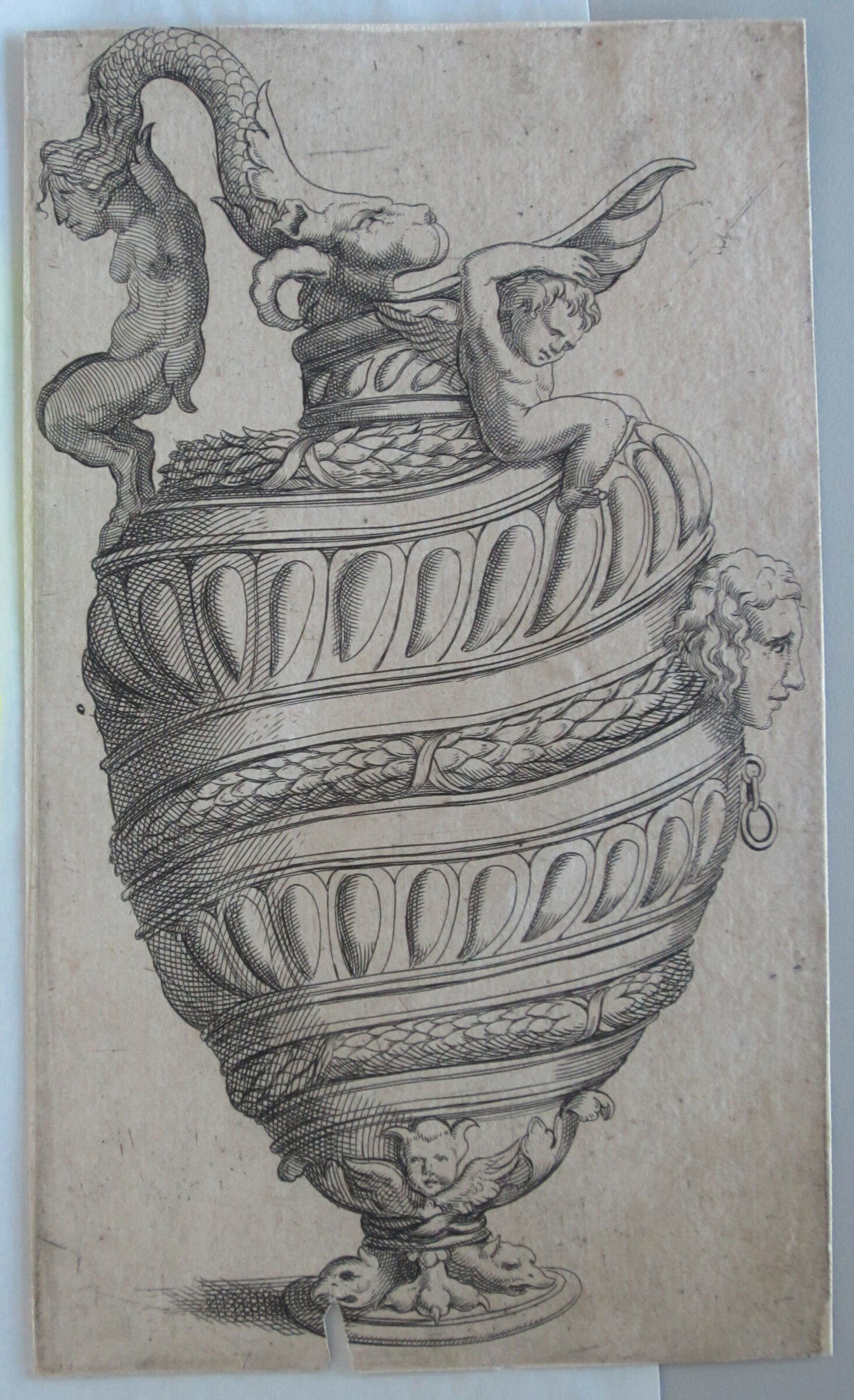 Ewer With Spiraling Bands Of Garlands And Gadrooning, Its Spout Supported By A Winged Putto