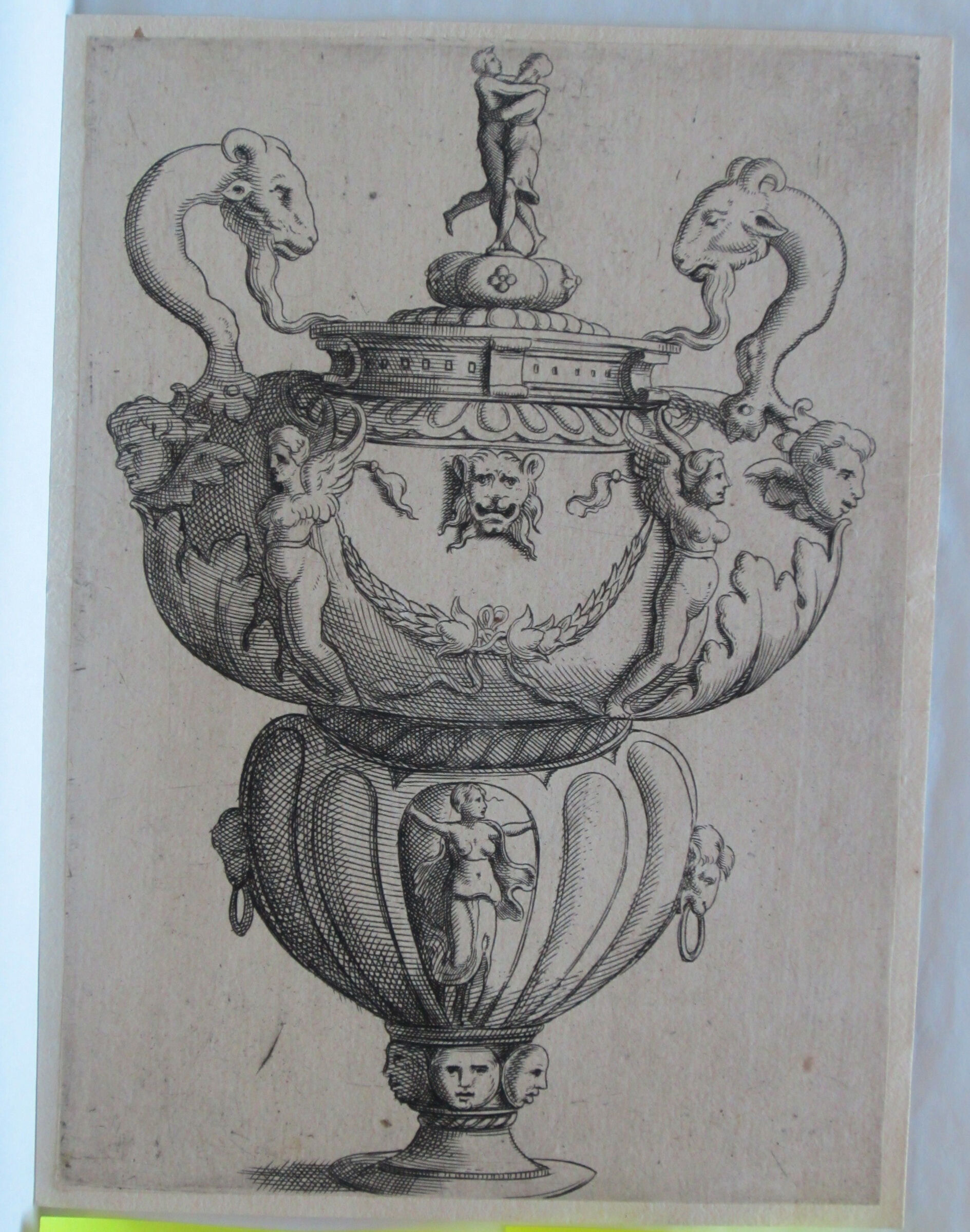 Covered Vase With Goats' Heads As Handles, An Embracing Couple On Its Knob