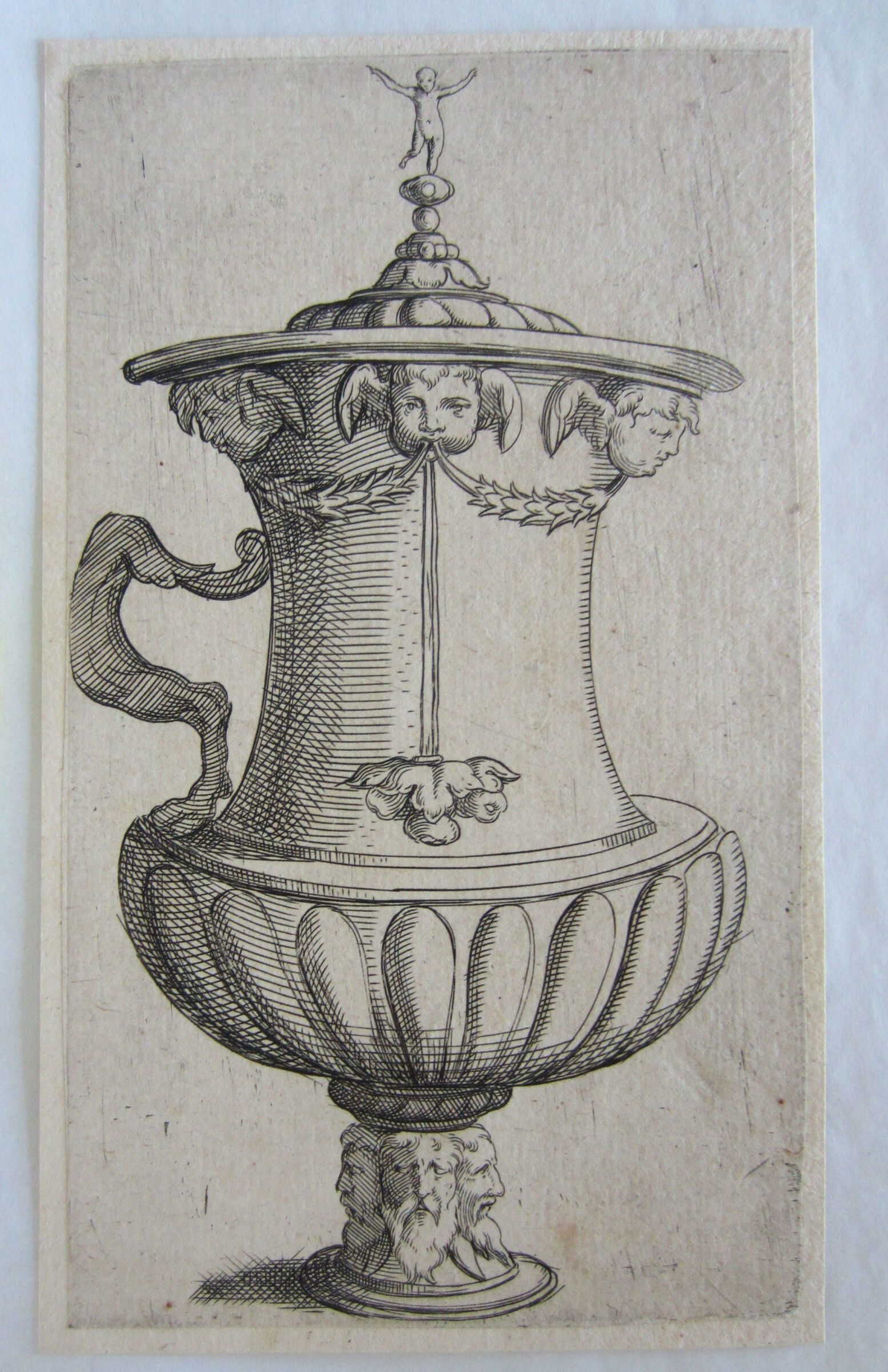 Covered Vase With Winged Putti Heads, A Putto Dancing On The Knob