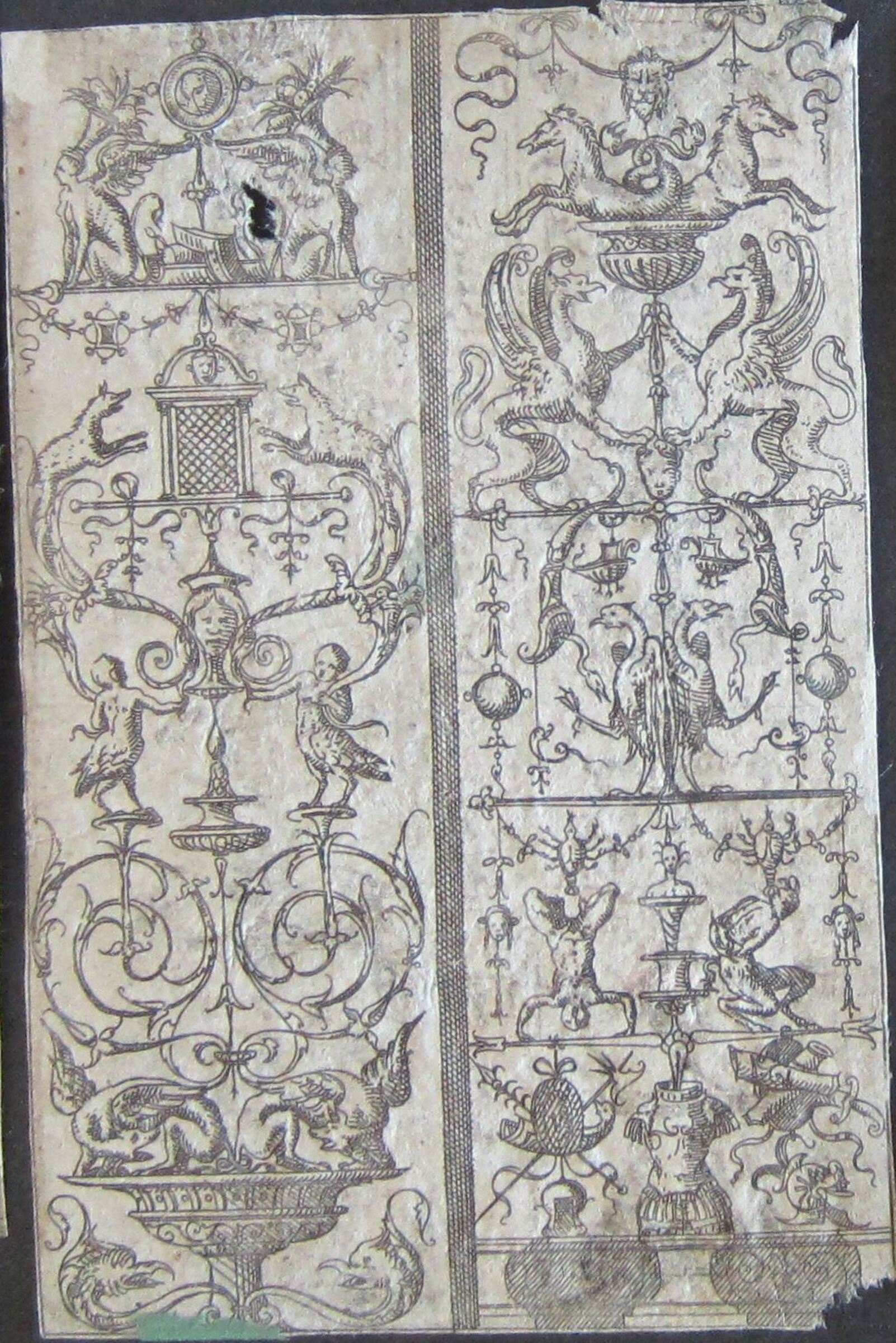 Two Grotesques Separated By A Shaded Band, The Right Grotesque With A Man Doing A Handstand