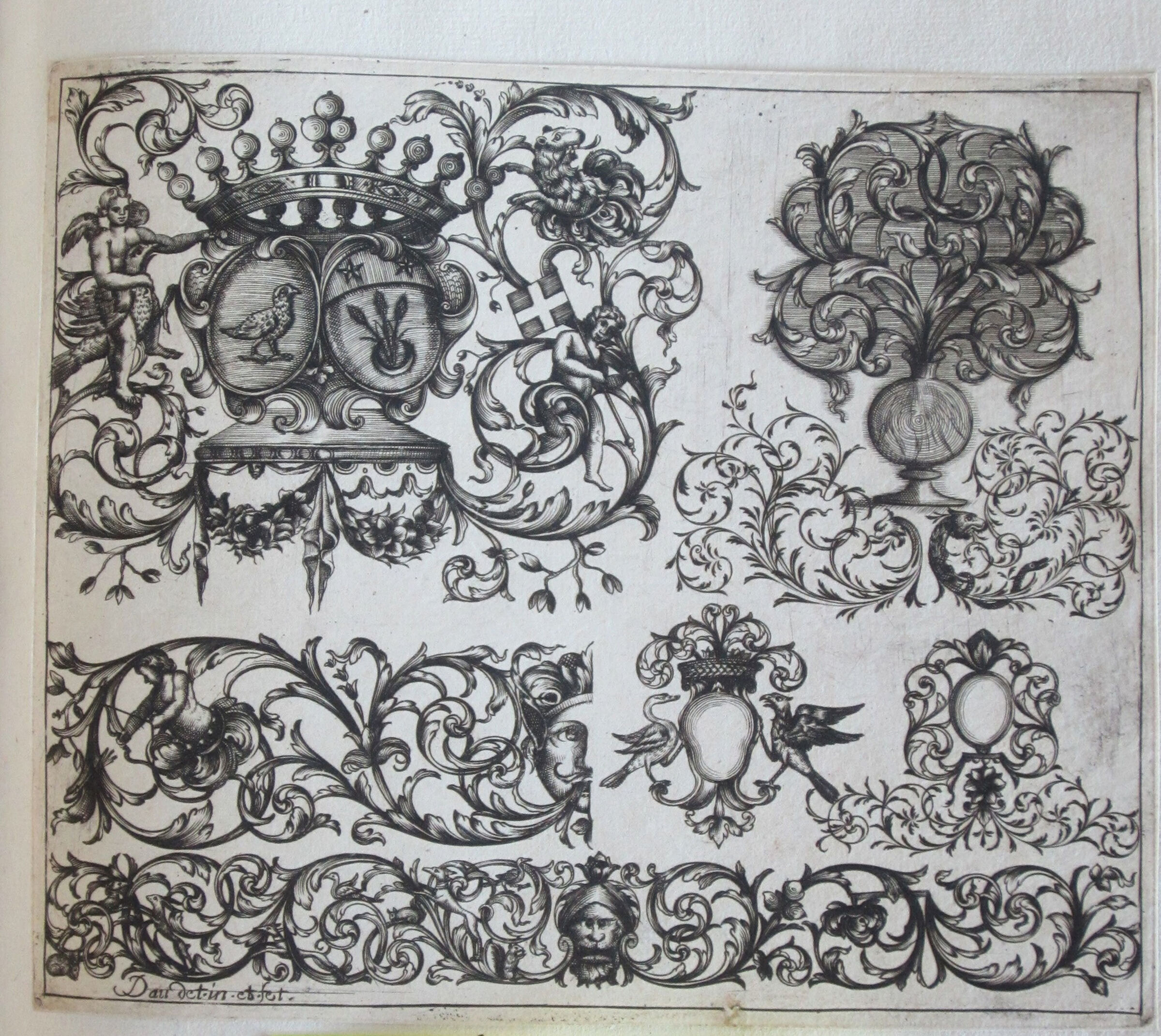 Seven Foliate Moresques, The One At Upper Left With Two Armorials Surmounted By A Crown Set With Pearls