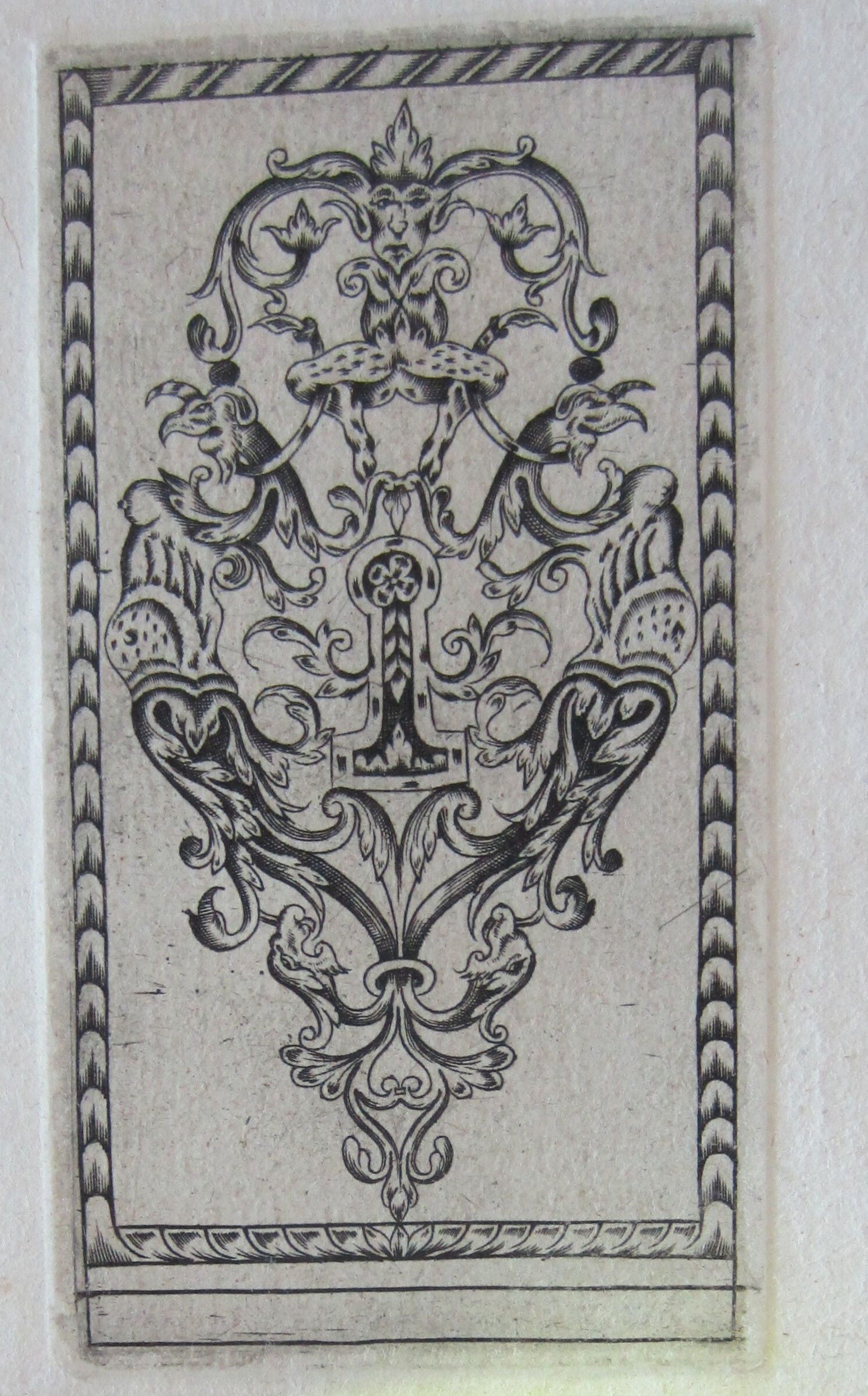 Escutcheon With A Dappled Monster Squatting Above The Keyhole Ornamented With A Four-Petaled Flower