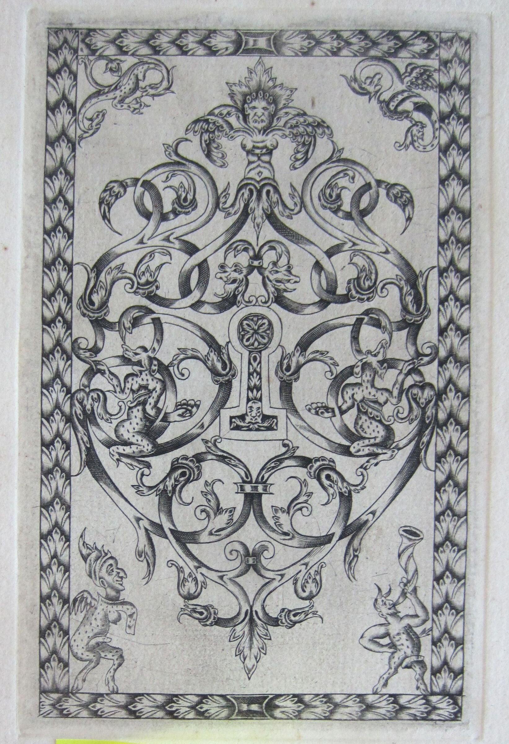 Interlace With Masks And Dappled Monsters, A Centered Keyhole Ornamented With A Four-Petaled Blossom