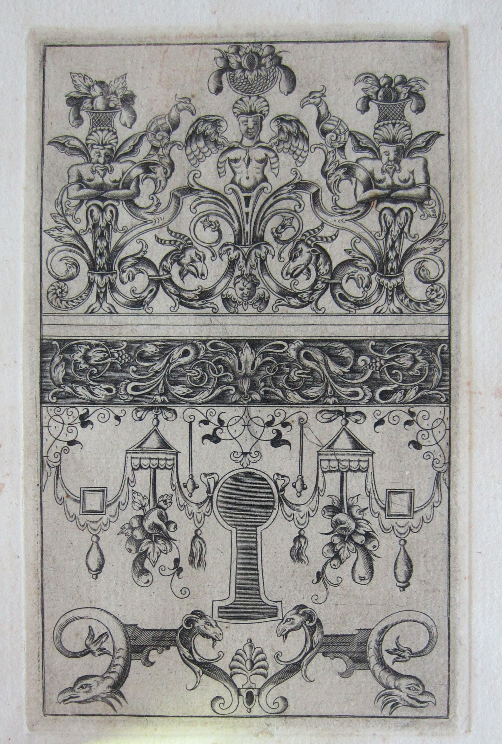 Elaborate Escutcheon With One Female And Two Male Terms Bearing Baskets Of Fruit On Their Heads